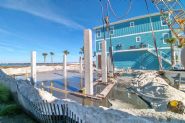 Modern coastal piling home on Navarre Beach by Acorn Fine Homes - Thumb Pic 7