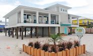 Moreland modern piling home on Navarre Beach by Acorn Fine Homes