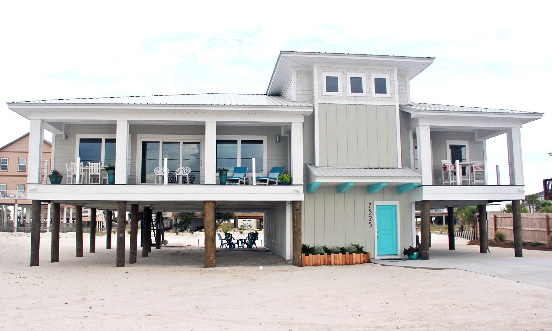 Moreland modern piling home on Navarre Beach by Acorn Fine Homes