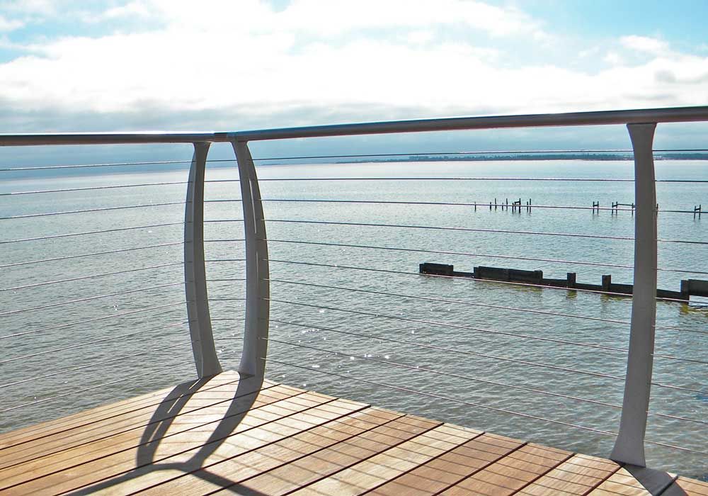 Stainless steel cable railing by Acorn Fine Homes