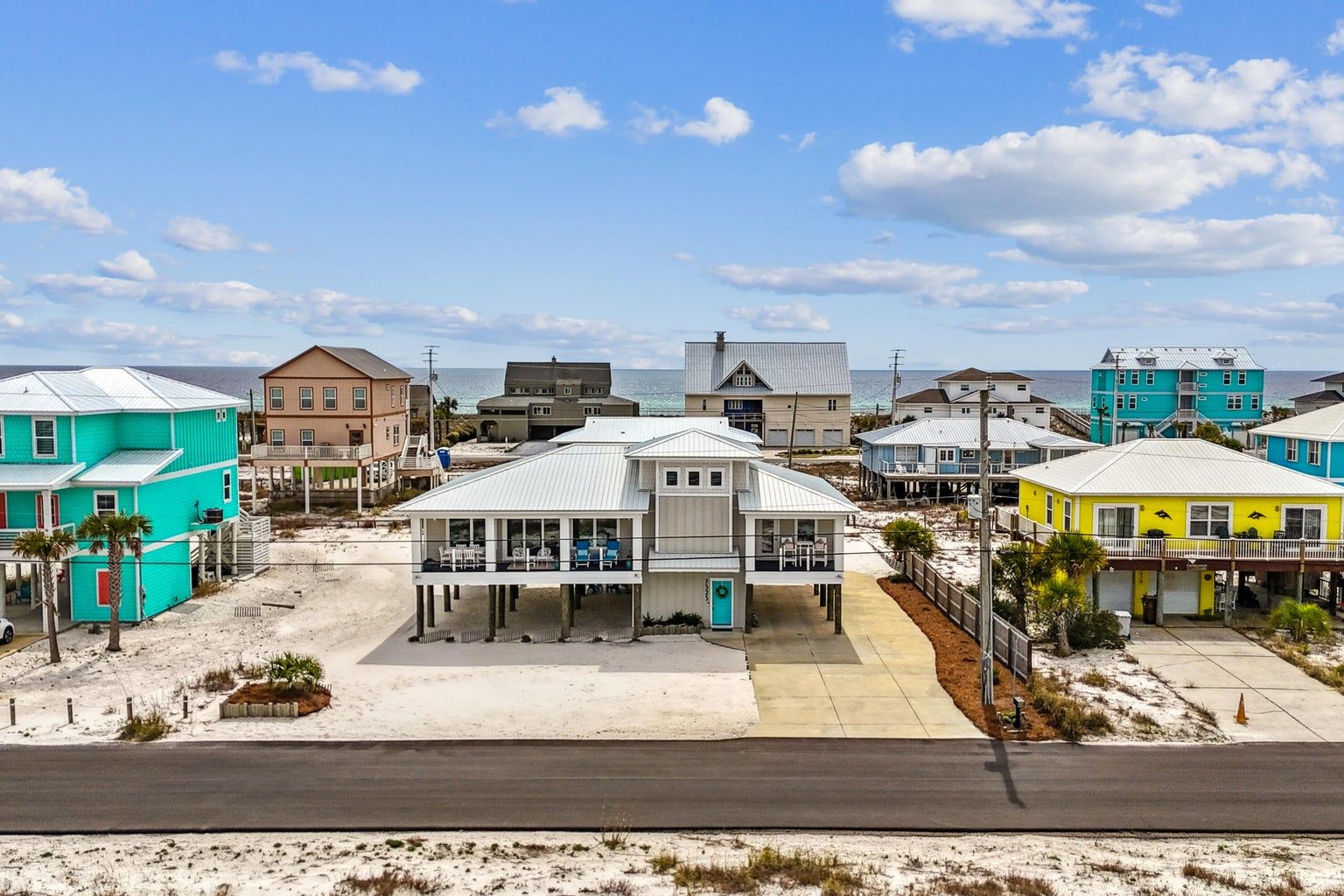 Moreland modern piling home on Navarre Beach by Acorn Fine Homes