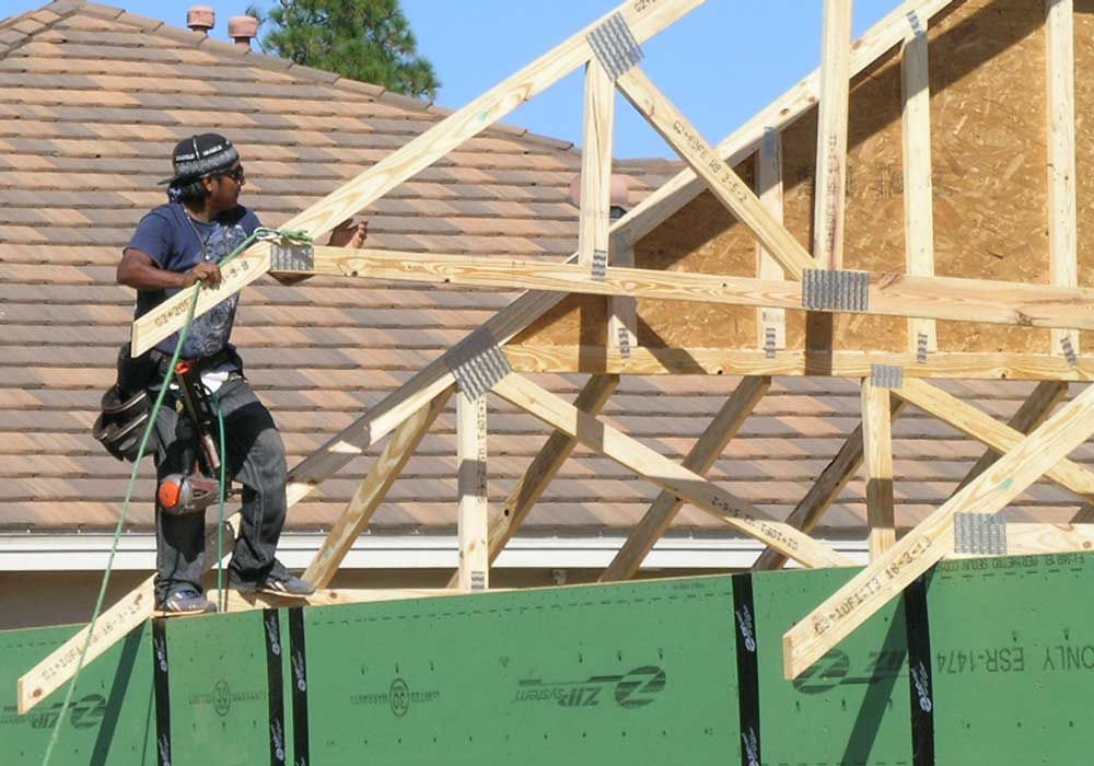 installing a common truss on the roof for Acorn Construction
