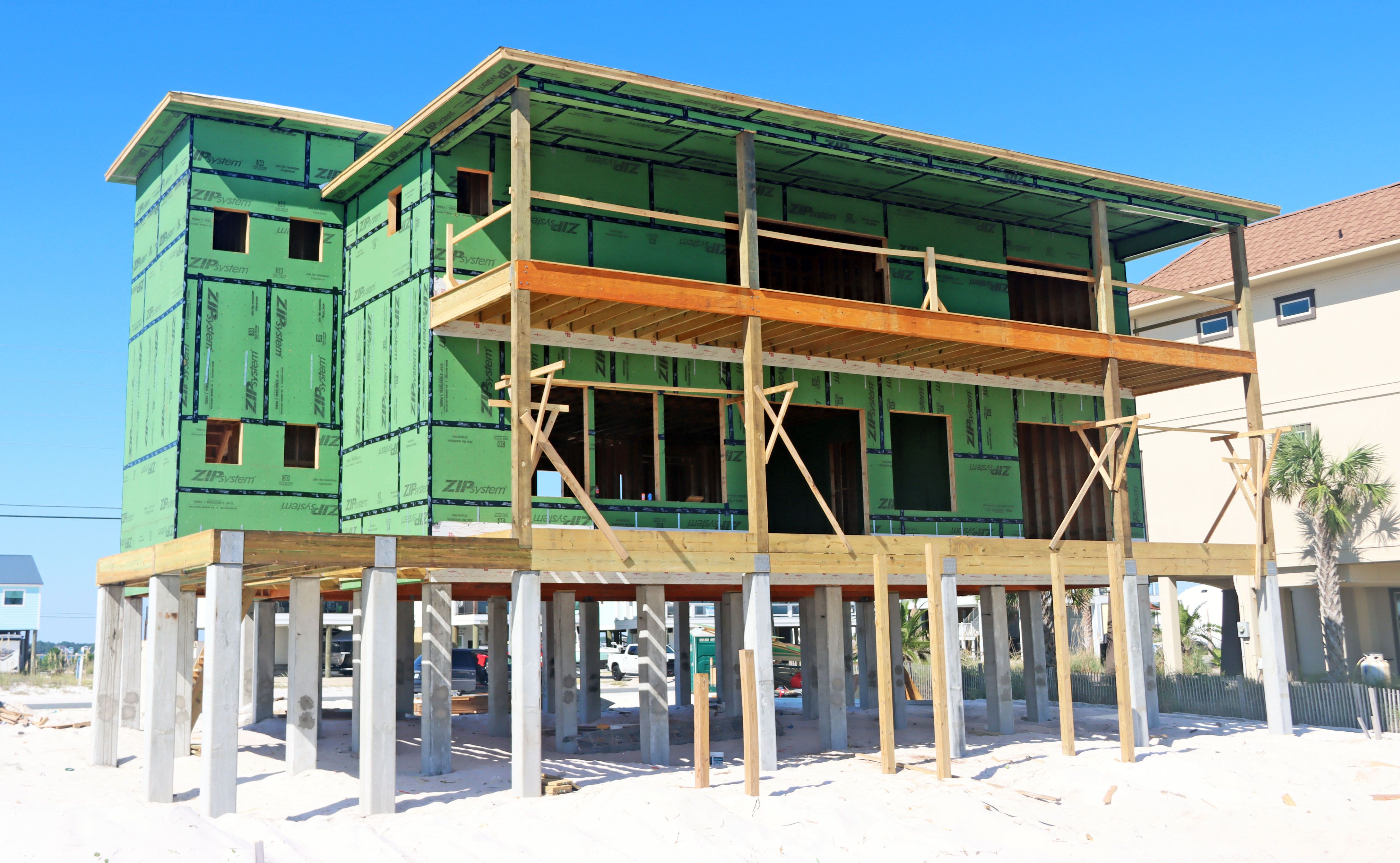 Ramsey modern coastal piling hojme in Navarre Beach by Acorn Fine Homes