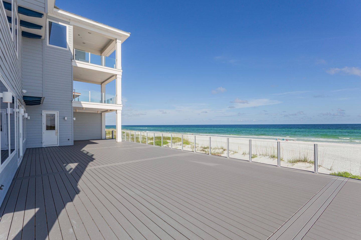 Modern coastal piling home in Navarre by Acorn Fine Homes