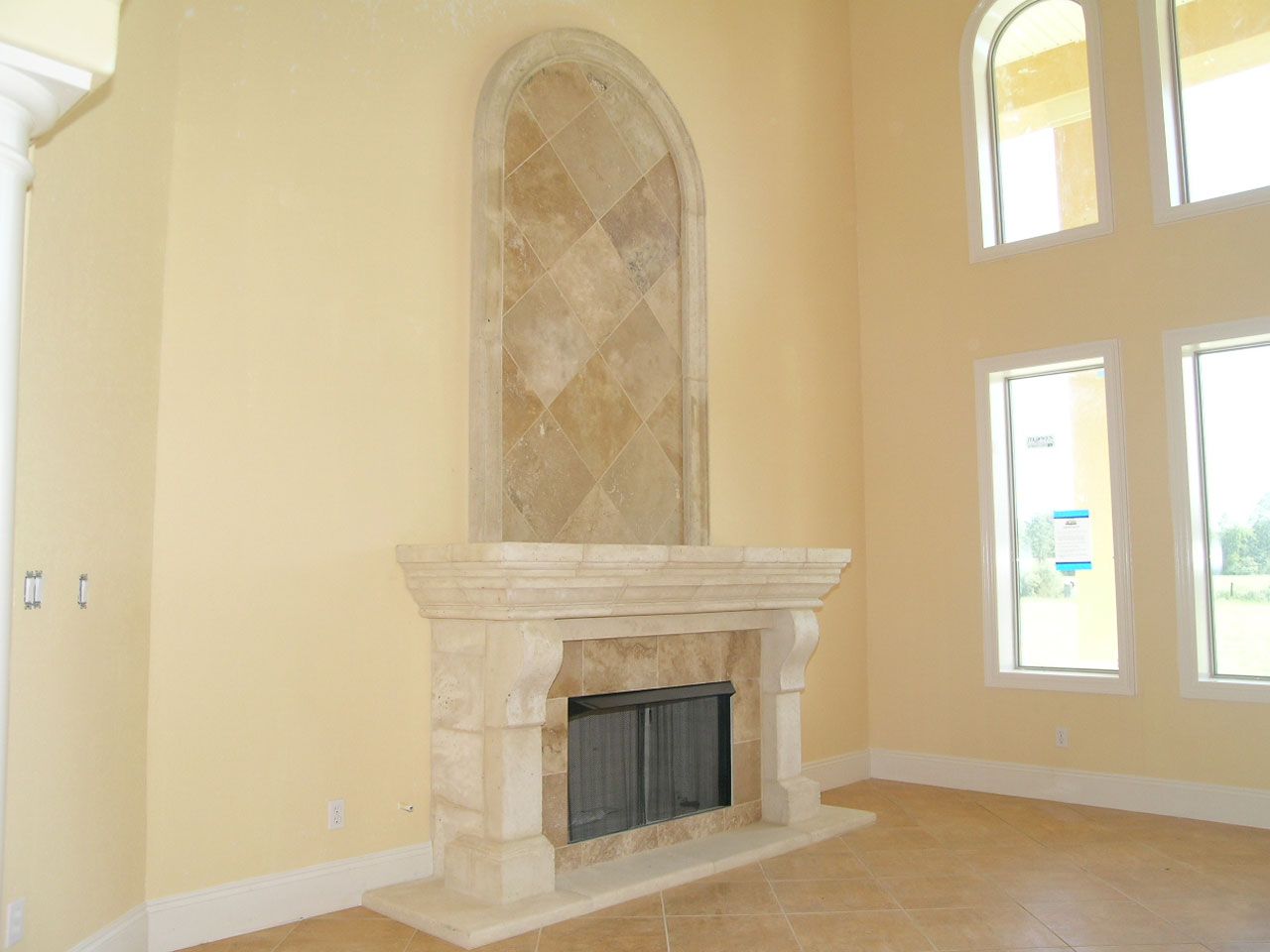 cast stone fireplace by Acorn Fine Homes