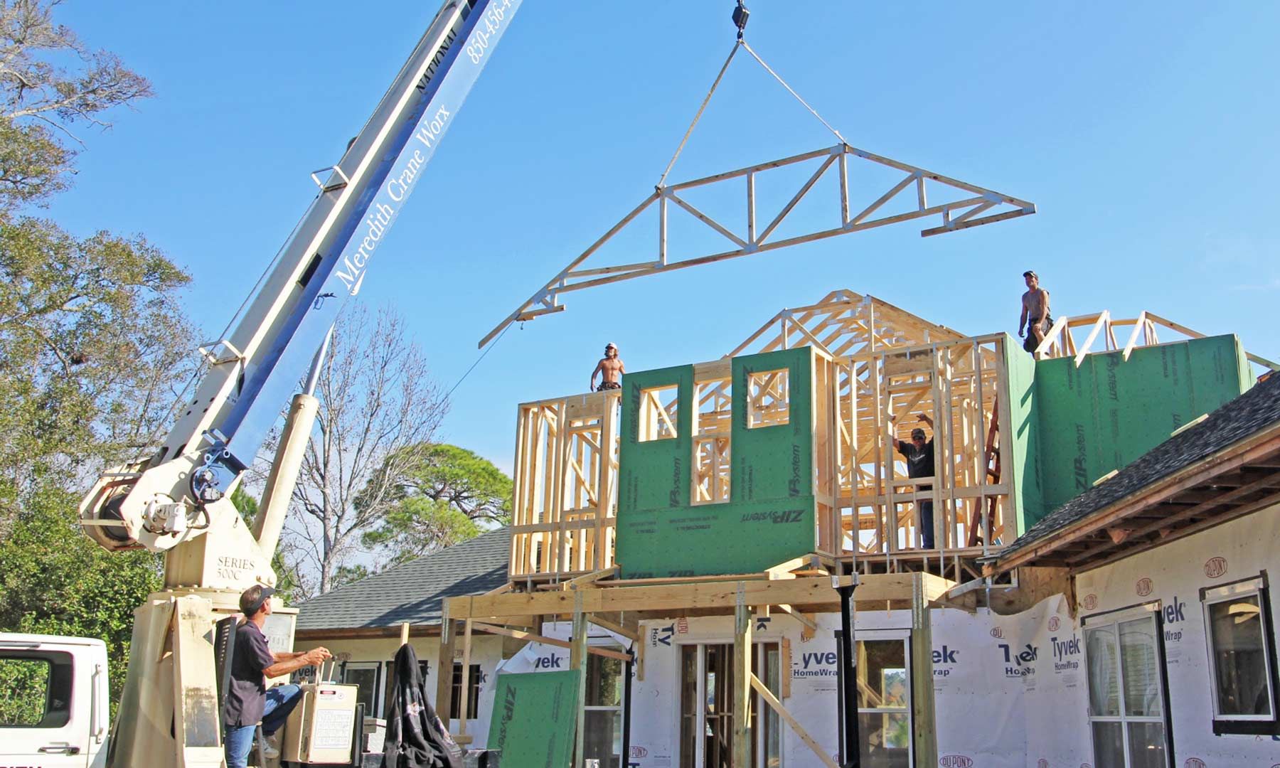 Seidel remodel in Pensacola by Acorn Fine Homes setting trusses