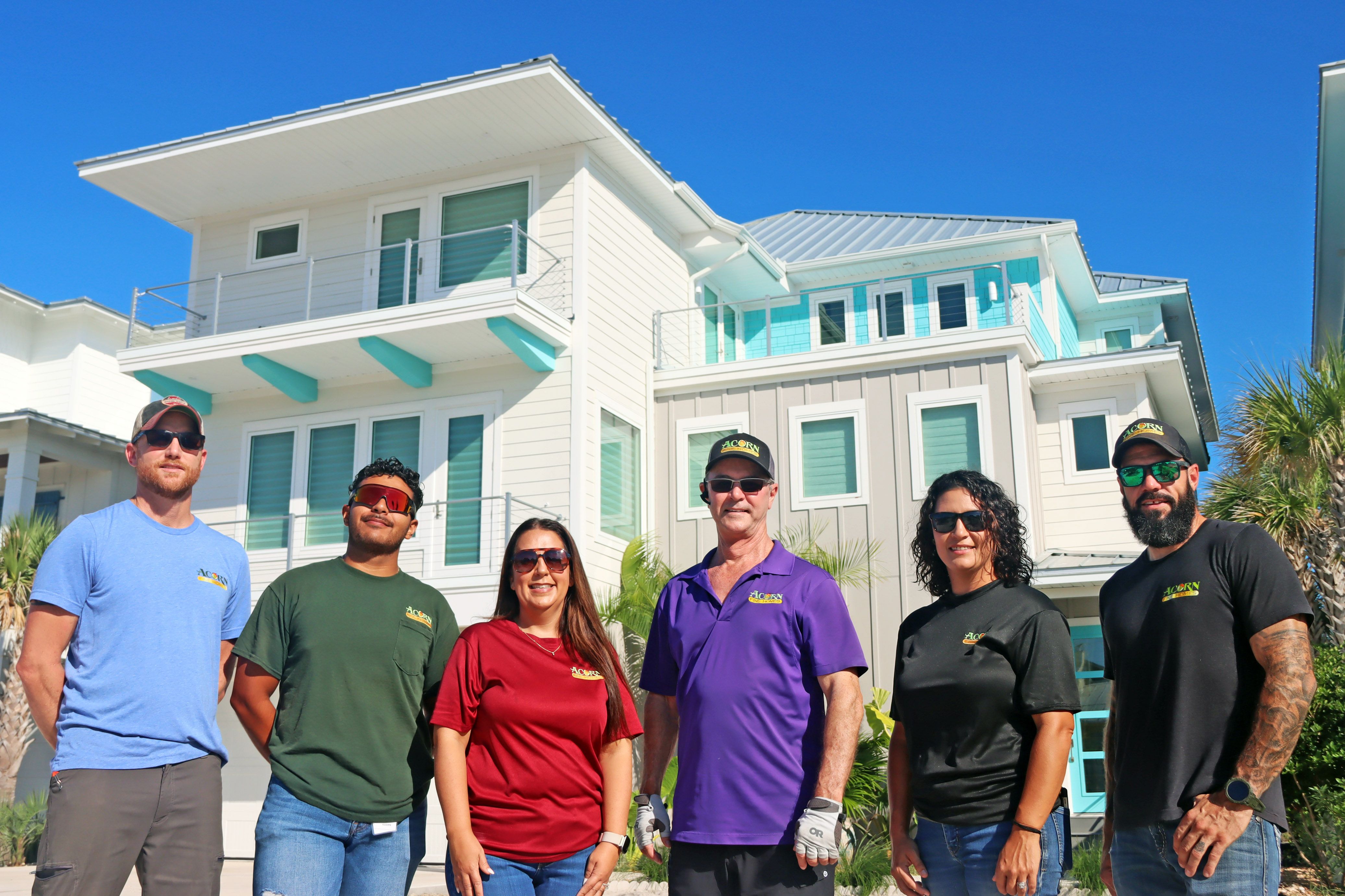 Modern coastal piling home in Navarre by Acorn Fine Homes