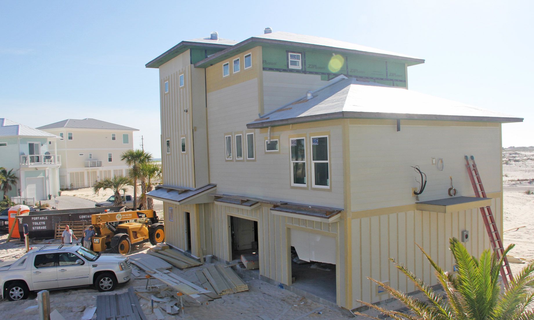 Slone modern coastal piling home on Navarre Beach by Acorn Fine Homes