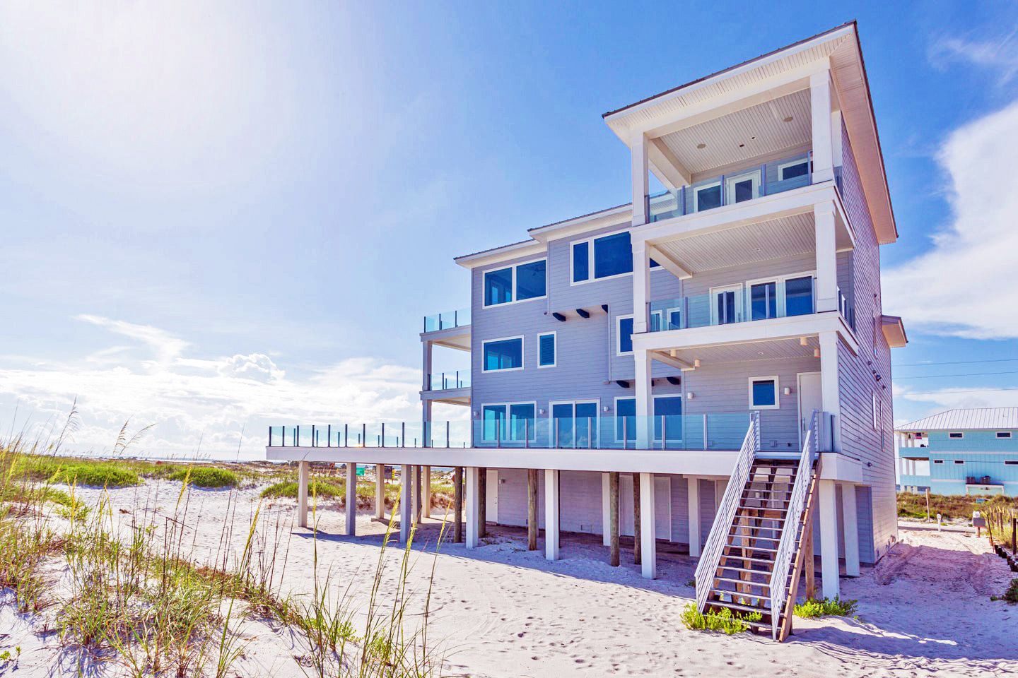 Modern coastal piling home in Navarre by Acorn Fine Homes